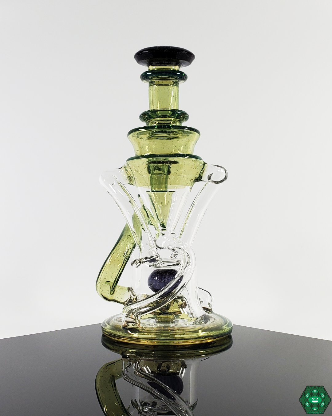 V2 Double Recycler with Triple Drain: The Cerio Glass V2, designed for enhanced airflow and smooth, filtered hits with its dual uptake and 4-hole percolator.