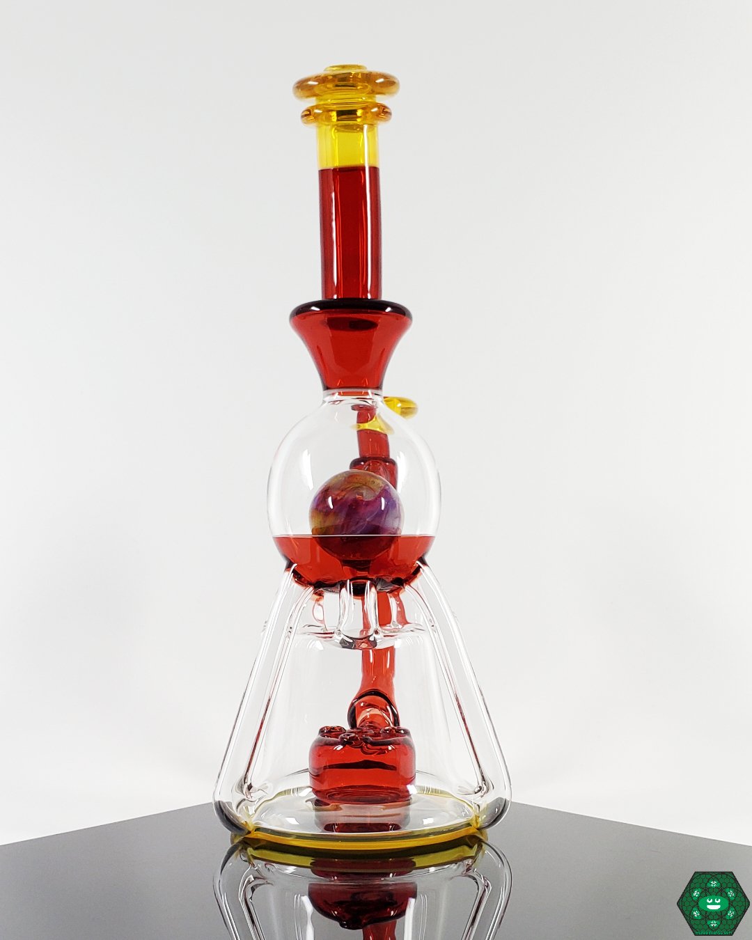  Vasuki Recycler with Triple Uptake: The OM Glass Co Vasuki offers smooth and filtered hits through its innovative triple uptake and 3-hole perc design, ideal for those who value efficient craftsmanship.