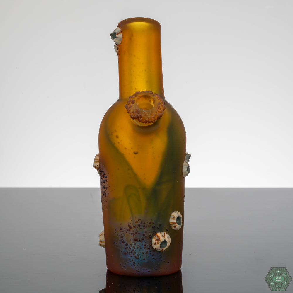 Whitney Harmon Barnacle Chubby Bubby Rig, a unique heady glass art piece combining quirky design with functionality, featuring a barnacle-inspired structure that adds a distinct flair, perfect for collectors and enthusiasts, blending personality and usability in one remarkable form.