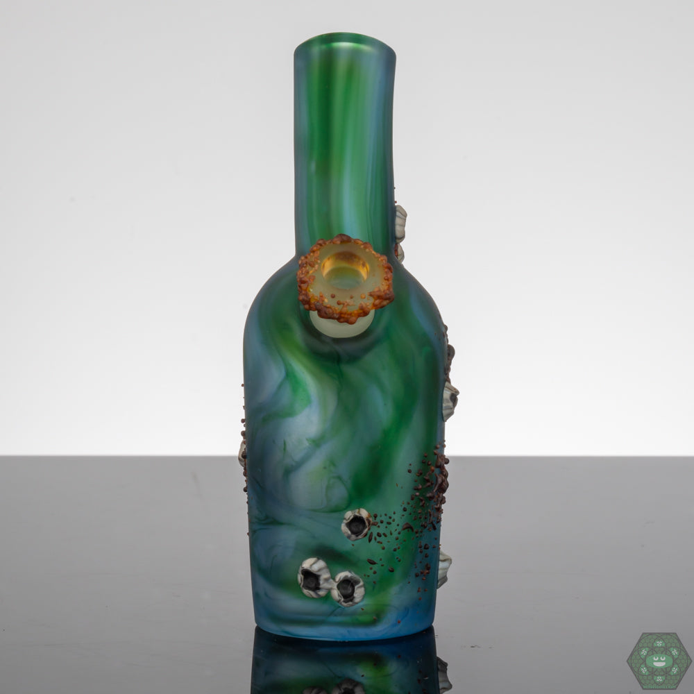 Whitney Harmon Barnacle Chubby Bubby, a unique handcrafted glass art piece featuring intricate barnacle detailing, designed by Whitney Harmon, made with high-quality glass for durability, perfect as a collector’s piece or functional art, adding artistic flair to any glass collection.