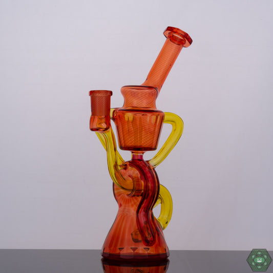 Wolfe Glass Triple Single Donut Recycler, a 10mm handcrafted recycler rig featuring a unique donut-shaped perc design for smooth and consistent hits, combining aesthetics and functionality, perfect for collectors and enthusiasts seeking a visually appealing yet functional rig.


