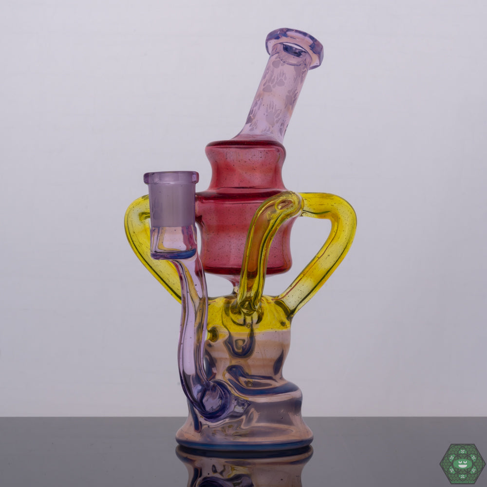 Wolfe Glass Triple Single Recycler, a 7.75" rig offering style and function with options like Phoenix Crushed Opal, Rose Quartz, Ghost, Citron, and Ghost with Crushed Opal, featuring a 4-hole perc, dual uptake, single external drain, and a faceted mouthpiece and joint, a 14mm 90-degree female rig providing powerful filtration and minimal splash, an exceptional collector’s piece for serious glass enthusiasts.
