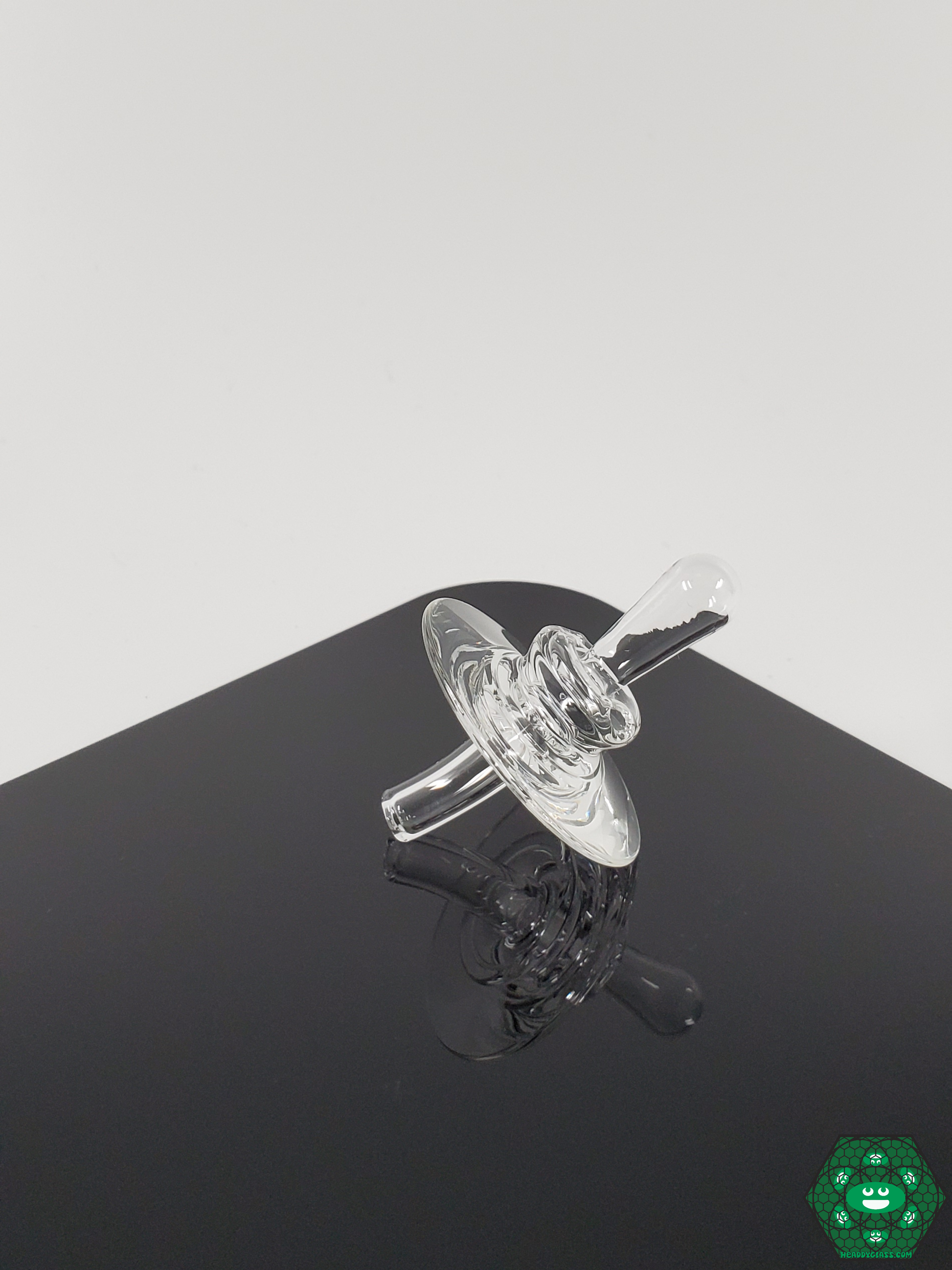Zach Brown Dab Caps with a transparent design, allowing better visibility of concentrates while vaporizing for an enhanced experience.